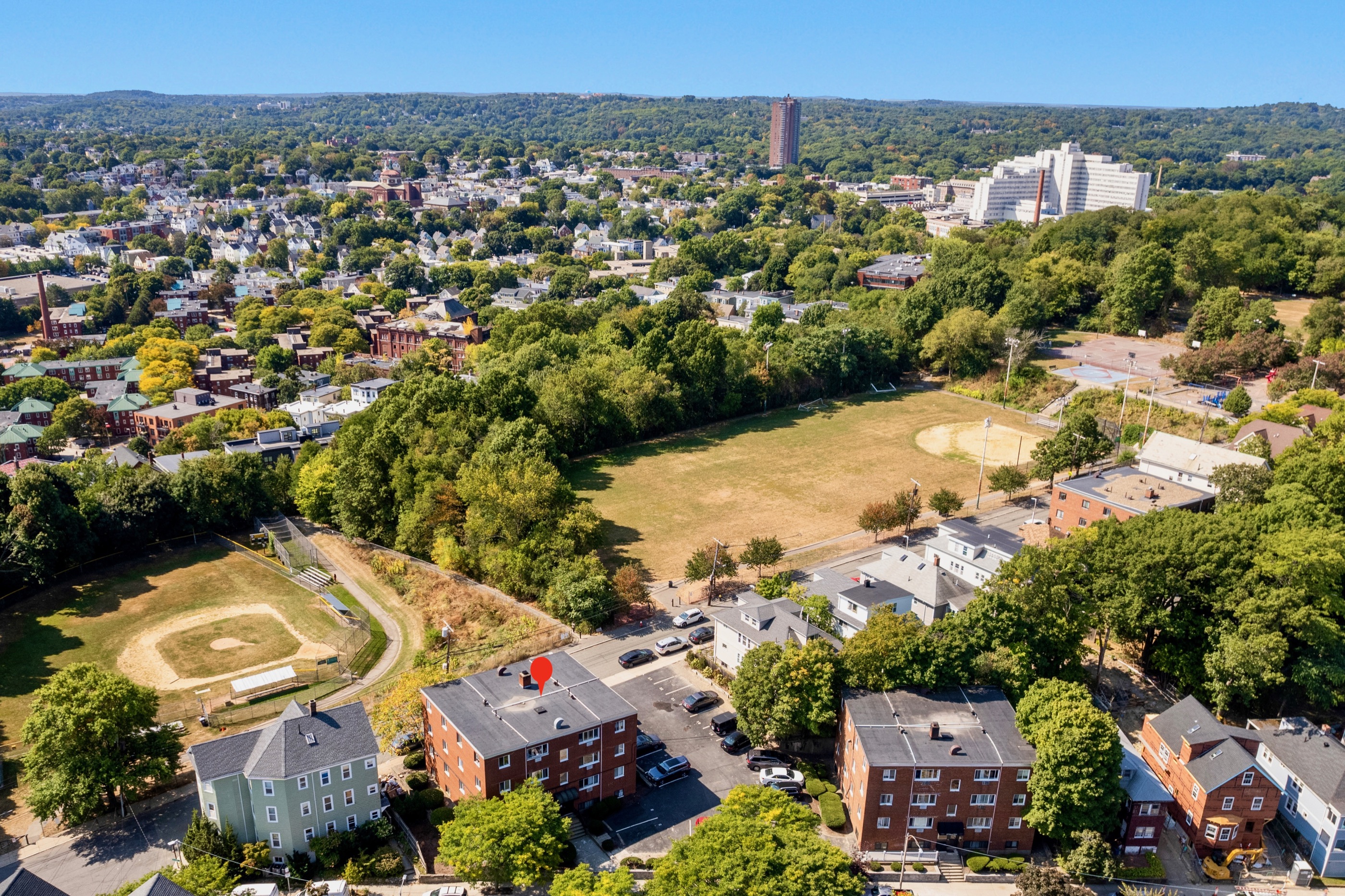 Aerial view of 197 Calumet and McLaughlin Playground, with Jamaica Plain and Jamaica Pond beyond